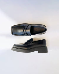 Mocassin noir moderne à talon pour homme 