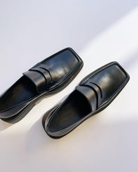 Mocassin noir moderne à talon pour homme 